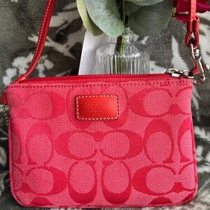 Coach Signature Canvas Wristlet in Red.